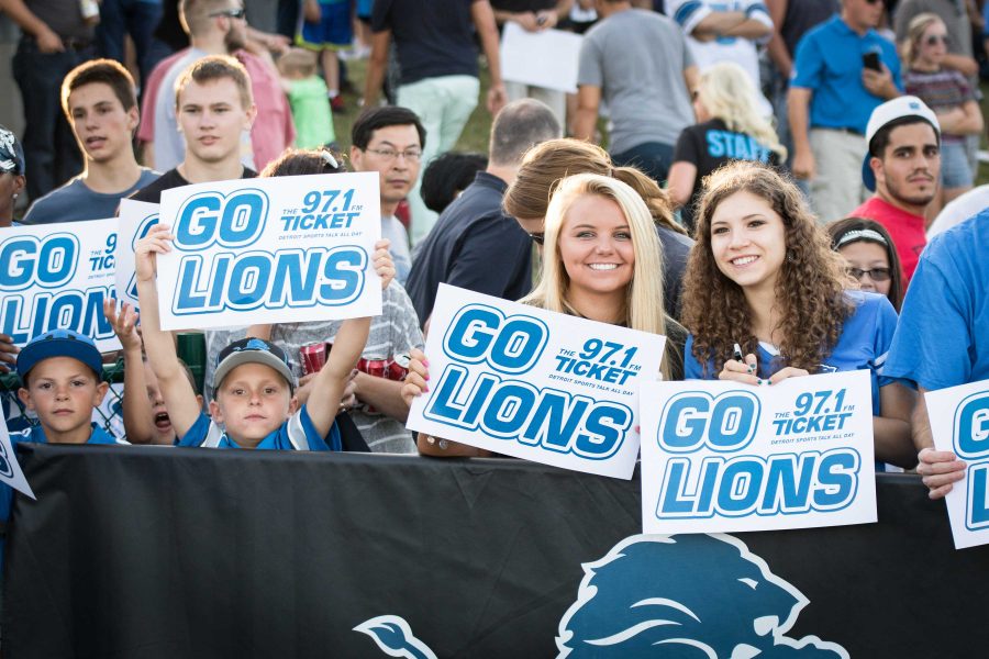 Thousands of faithful Detroit Lions fans flock to Novi High School to support the team during their first open practice.