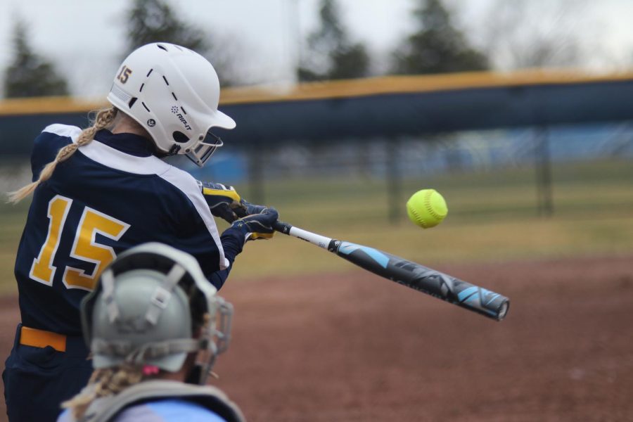 Schoolcraft left fielder Katie Koszykowski hits a line drive to center for a single against Macomb Community College on April 8, 2022.