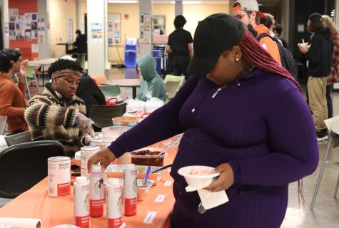 Student adds toppings to ice cream at the Make-it-Take-it ice cream social on September 29, 2022 in the Lower Level of the VisTaTech Center.