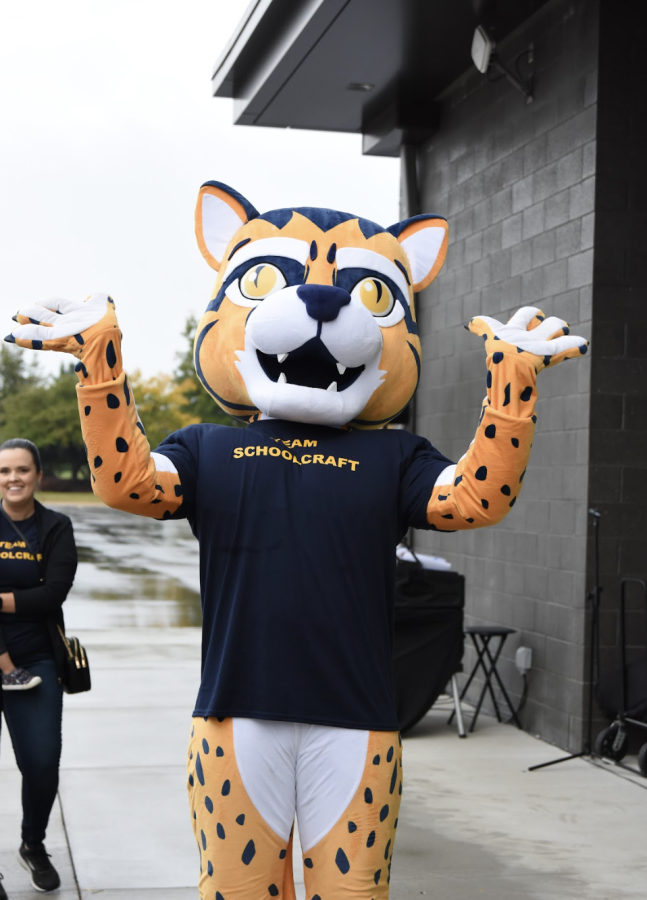 Ozzie the Ocelot pumps up the crowd during the Healthy Livonia 5k held on the campus of Schoolcraft College on Sunday, September 25, 2022.