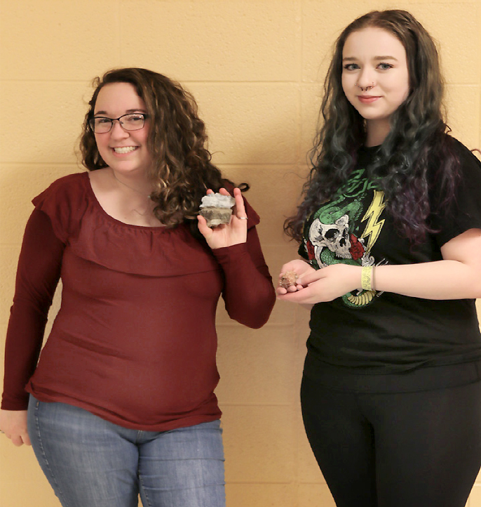 Co-Presidents of the Earth and Geoscience Club (EGC) Stephanie Durant (left) and Caroline LaPointe (right) pose for a photo prior to their club meeting. Meetings take place Mondays, with the current dates of March 20 and April 10, from 4-5 p.m. in Forum room 360.