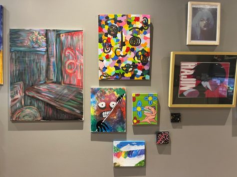 Some of the student artwork on display at Sweet BrewN Spice in downtown Northville.