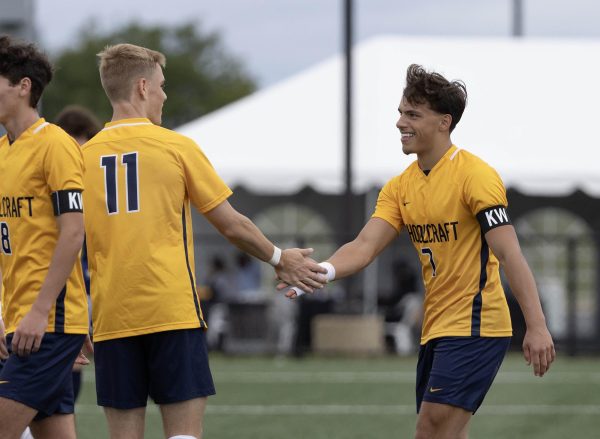 Forward Dante Davidson (right) shakes hands with his teammates after scoring one of his four goals in the game. The Ocelots went on to win 14-0 against Terra State CC on Saturday, September 9, 2023 at Schoolcraft College.