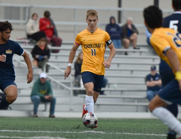 Gavin Brose carries the ball down the field during a match against Ancilla on Sept. 27, 2023 at Schoolcraft College. Brose scored 3 goals in the game.