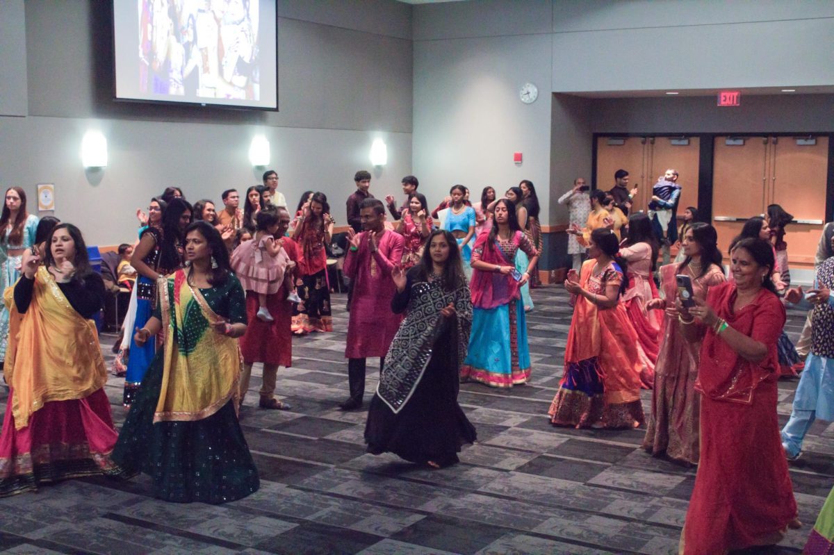 Patrons gather to dance to live music performed by Kuldip Bhatt at the Navratri Garba on Oct. 28, 2023 at Schoolcraft College.