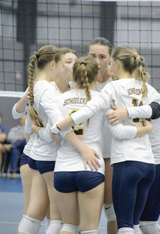 The volleyball team huddles prior to the start of their match during the 2023 season.