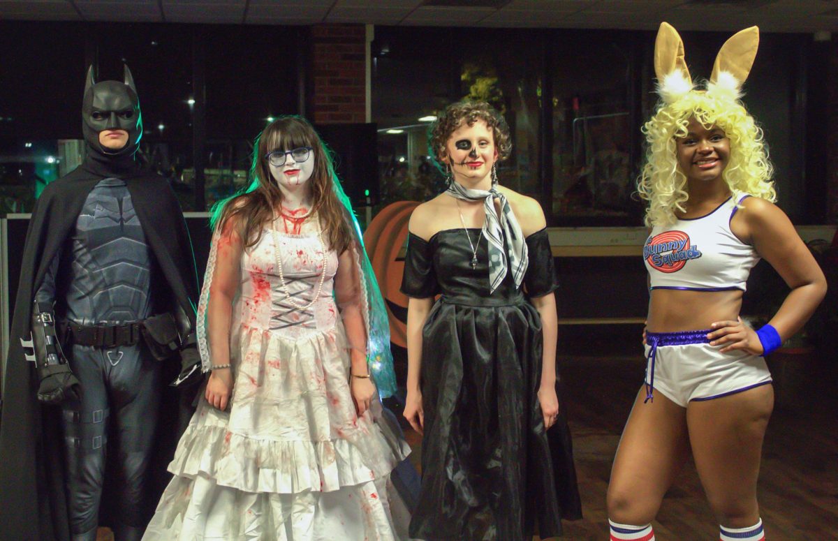 Winners of the costume contest pose for a group photo at Halloween Party on Oct. 26, 2023 in the Lower Level, Vistatech Center.