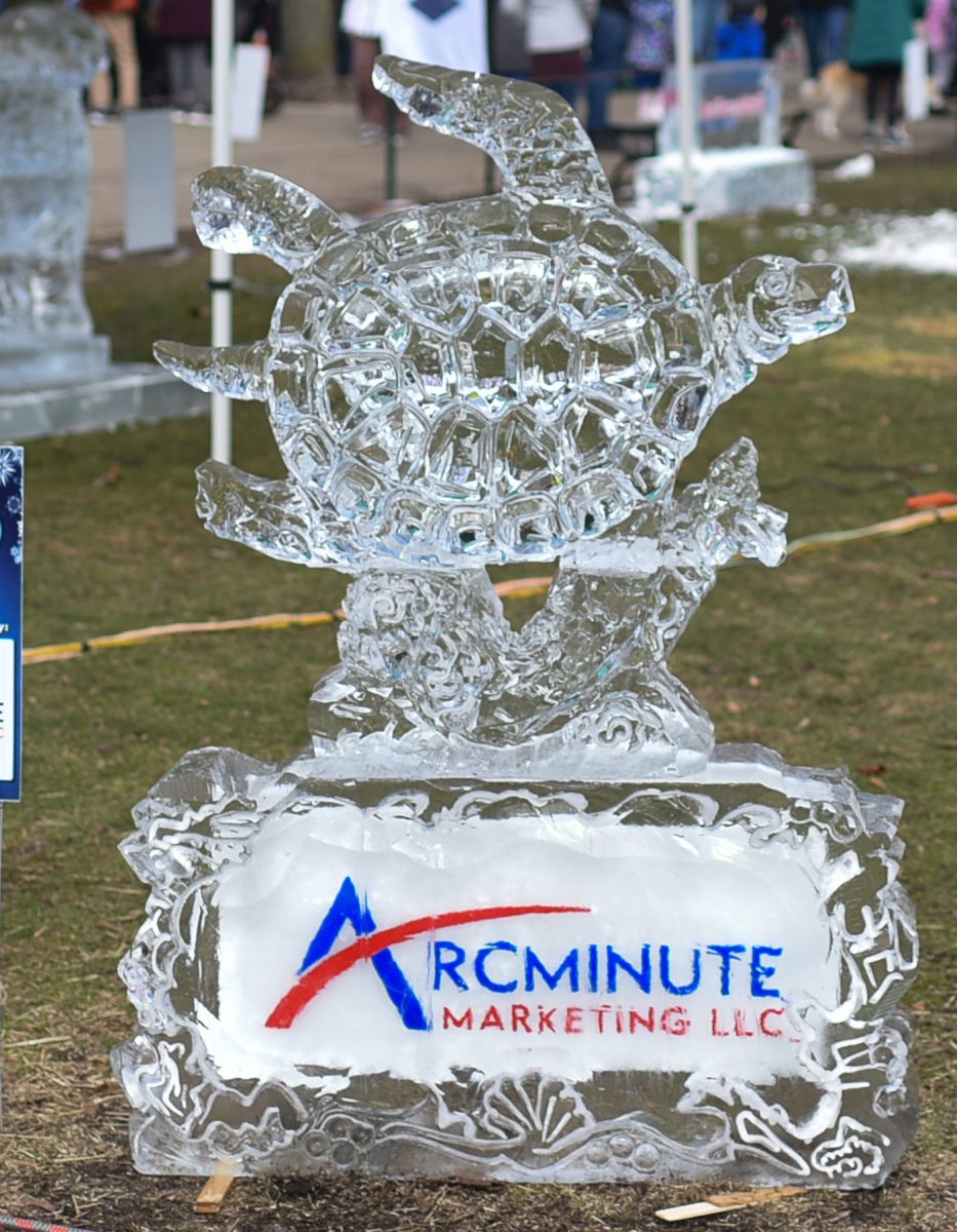 Each sculpture of Plymouth Ice Festival has a company sponsor as a way of publicity Feb. 3, 2024 in downtown Plymouth, Michigan. Pictured here is a ice sculpture of a sea turtle spooned by Arcminute Marketing, LLC.