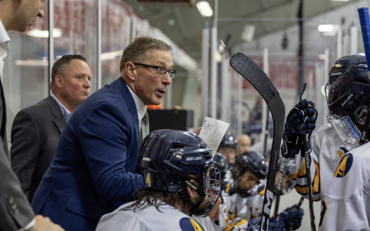 Schoolcraft Hockey Head Coach Dan Phelps talks to his players during a time out in the third period against Trine University on September 28, 2024 at Mike Modano Ice Arena in Westland, Michigan. (Photo courtesy of Schoolcraft College)