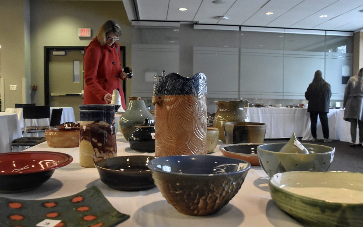 Patrons purchasing ceramic items at the Empty Bowl Luncheon. This years event is set for Dec. 5. (Photo courtesy of Schoolcraft College)