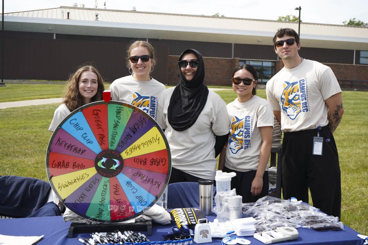 Recreational Services student employees pose for a photo at the Rec Services table at Ozzypalooza on Wednesday, August 27, 2025. They were giving out products for following the fitness center on social media.