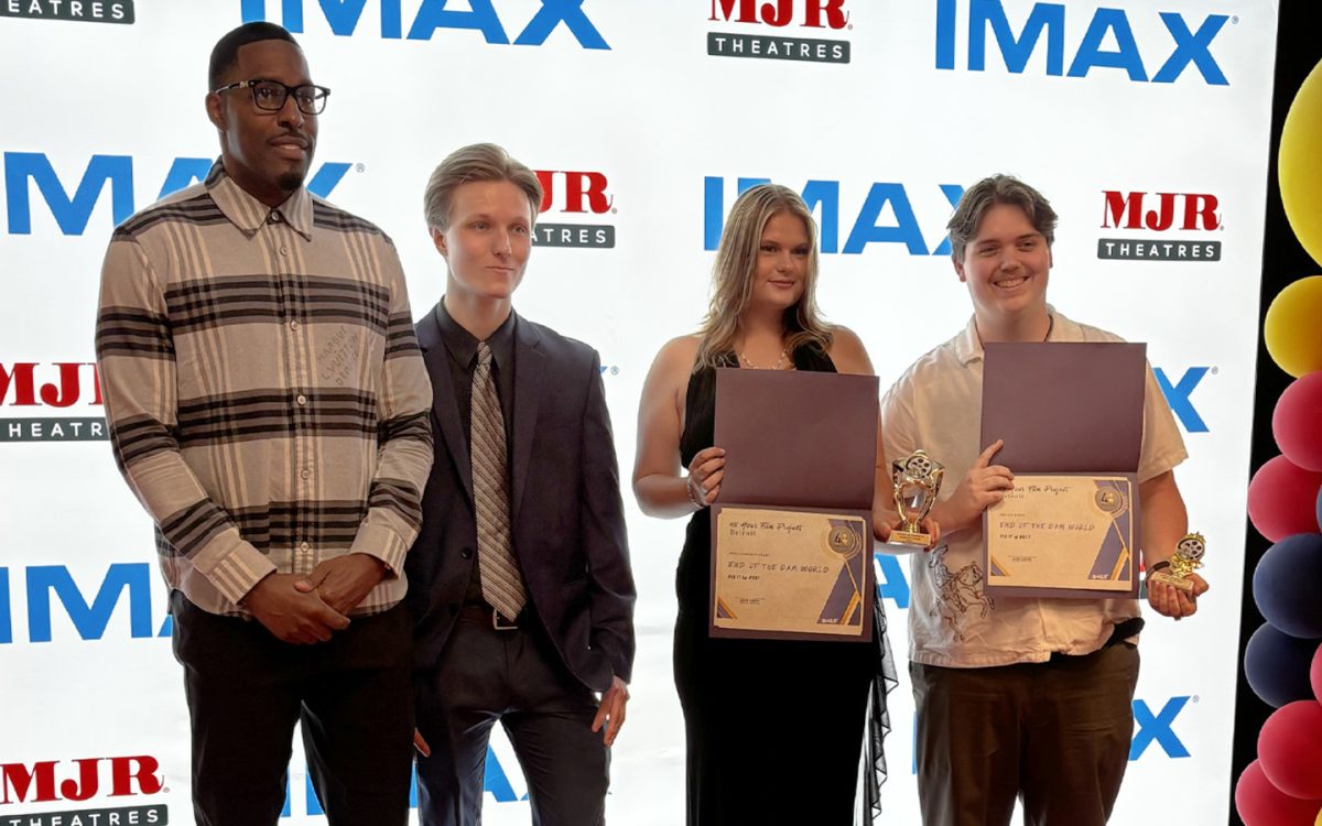 (Left to right) Jamal Jackson, Evan Allen, Julia Huff and Kyle Anderson pose for a photo with their awards from the Detroit 48 hour Film Challenge. (Photo courtesy of Evan Allen)