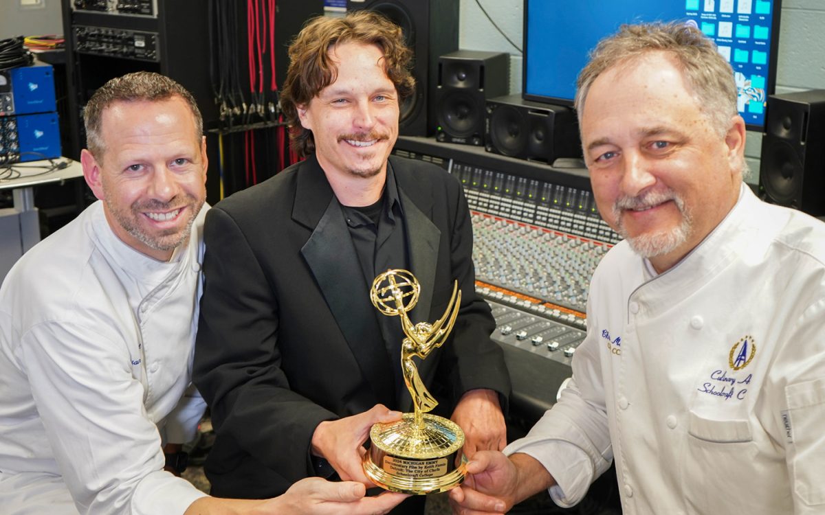 (Left to Right) Chef Brian Beland, Professor Jeremy Salo and Chef Chris Misiak pose for a photo with the Emmy that was won for their invovement with the “Detroit: The City of Chefs”documentary film.