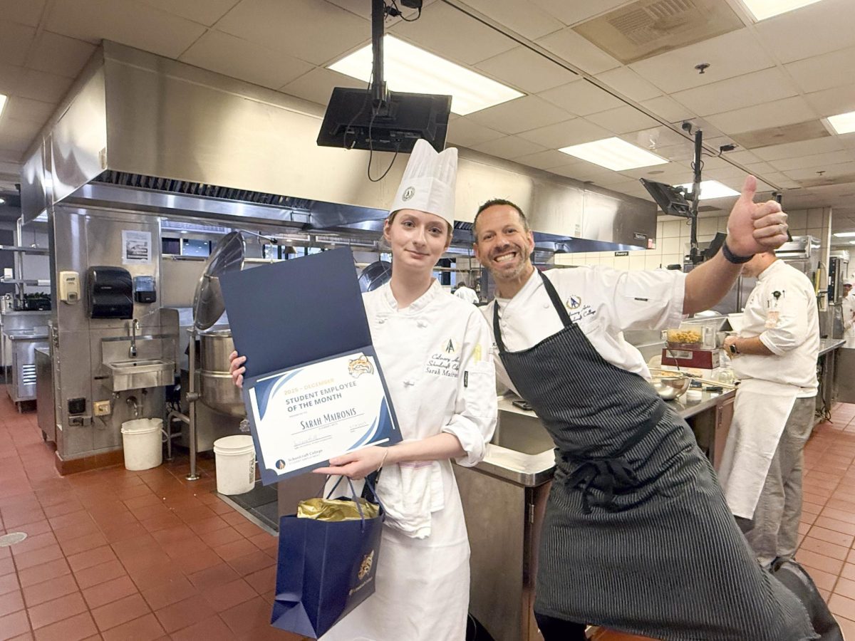 Schoolcraft Student Employee of the Month for December, Sarah Maironis, poses for a photo with Chef Brian Beland.