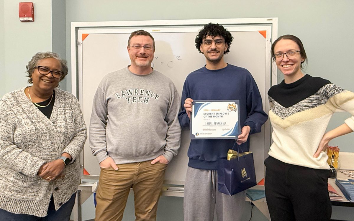 Student Employee of the Month Faisal Alnakhala celebrates his award with Learning Center supervisors (left to right) Debra Golden,Matthew Blagdurn and Kristen Engels